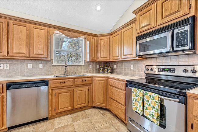 Stainless steel appliances, nice tile backsplash! | Image 5