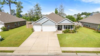 Craftsman house with a garage and a front lawn | Image 2