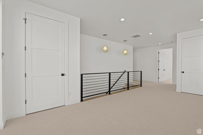 Hallway with an upstairs landing, carpet, and recessed lighting | Image 30
