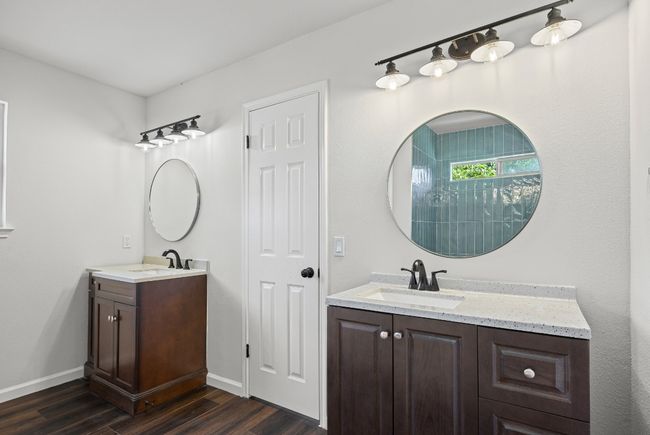 Full bath with two vanities and wood finished floors | Image 19