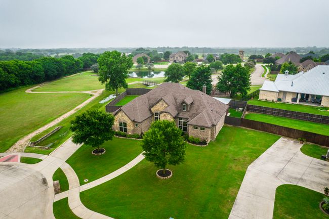 Aerial perspective of suburban area featuring a large body of water | Image 31