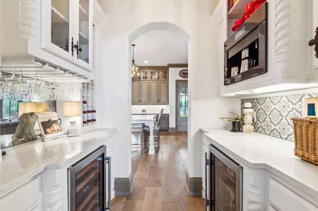 Next to the Kitchen, a Sophisticated Wine Bar and Coffee Station Featuring Dual Sub-Zero Refrigerators and a Built-In Miele Coffee System | Image 13