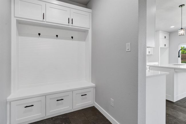 Mudroom with a sink, baseboards, and dark stone finish flooring | Image 19