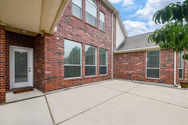 Enjoy endless outdoor moments on your Texas size backyard patio that enjoys shading from the home most of the day! With plenty of room, it’s the ideal setup for hosting memorable backyard parties and gatherings. Host all the summer barbecues with friends and family to your heart's content. | Image 35