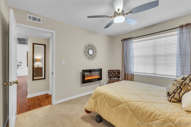 lBedroom two with a electronic fireplace | Image 4