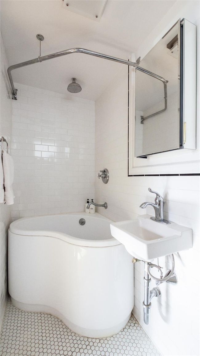 Full bathroom with tile walls, tile patterned floors, and a combined bath / shower with rainfall shower | Image 18