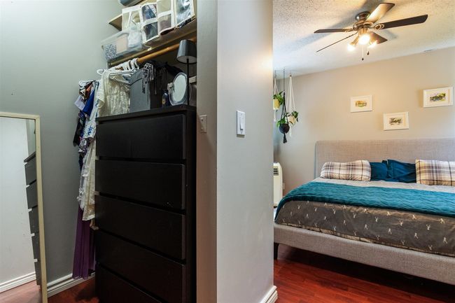 Bedroom with wood finished floors and a ceiling fan | Image 15