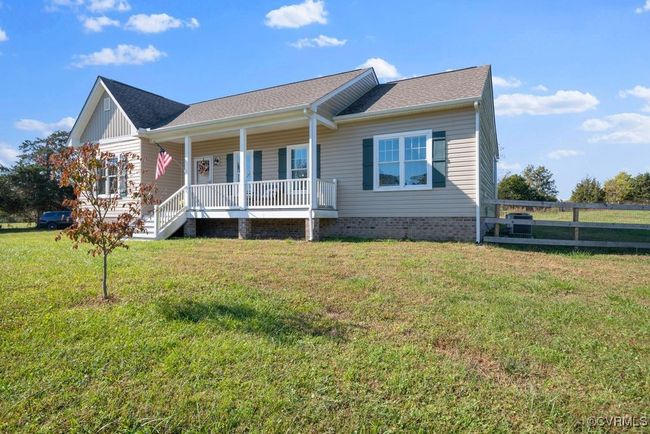 View of front of house with a porch, roof with shingles, a front yard, and fence | Image 36