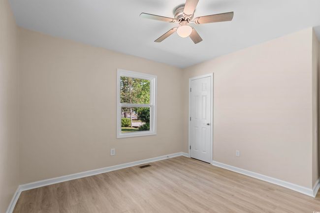 Unfurnished room with light wood-style flooring and a ceiling fan | Image 27
