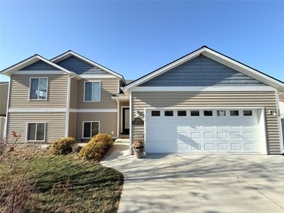 Craftsman-style home with a garage | Image 2