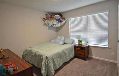 Bedroom with plush carpet flooring | Image 3