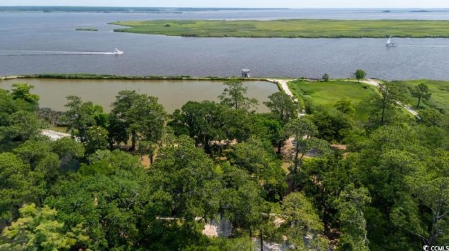 Aerial overview of property's location with a nearby body of water | Image 9
