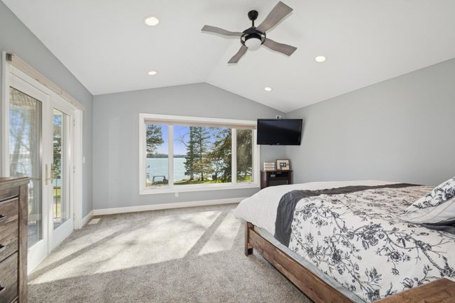 Main level primary bedroomsuite with amazing lake views! | Image 25