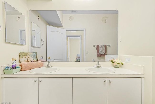 Bathroom featuring double vanity and a sink | Image 22