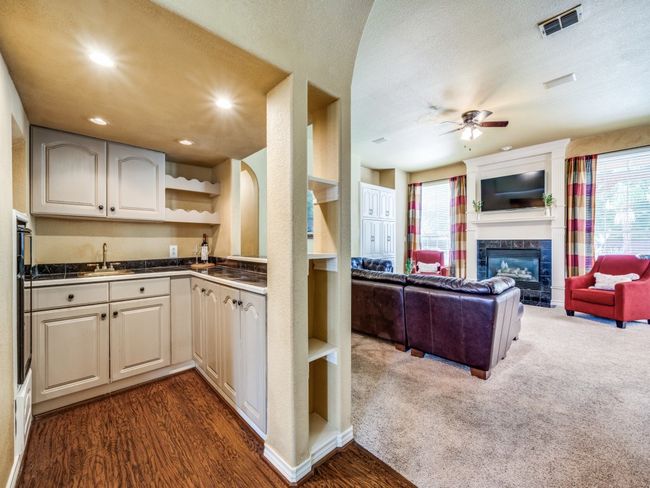 Wet bar features a wine cooler. | Image 7