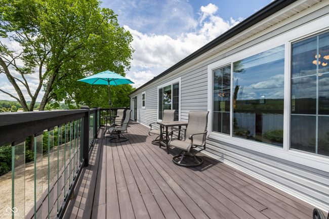 deck with outdoor dining space | Image 46