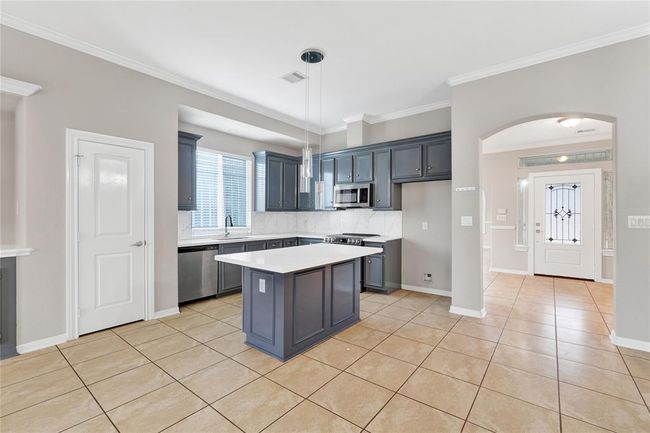 Beautiful open concept kitchen with beautiful quartz countertops. | Image 14