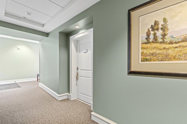 Corridor with baseboards and carpet | Image 39
