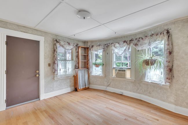 Front door-loads of windows in Dining/Den area | Image 13
