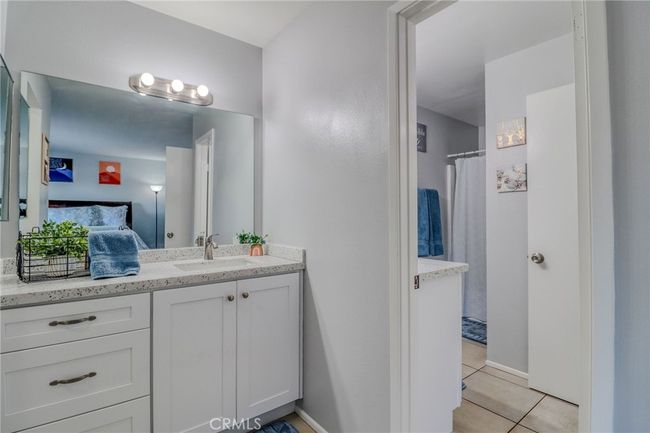 Primary Bedroom sink and vanity and view of bathroom | Image 18