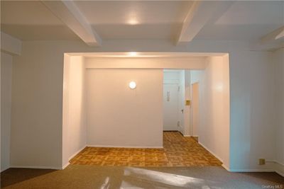 Entryway featuring light parquet floors and beamed ceiling | Image 3