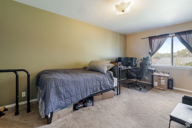Carpeted bedroom featuring baseboards | Image 15