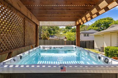 Low maintenance plunge/resistance pool, just the right size for a quick cool down while enjoying your expansive backyard and patio area! | Image 1