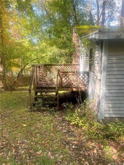 View of yard featuring a deck | Image 2