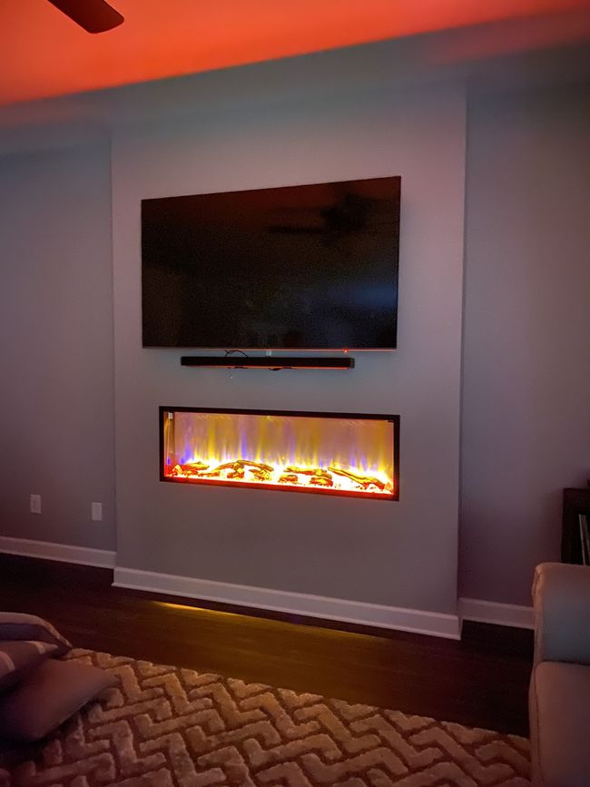 The fireplace has a remote so you can show whatever color fits the moment | Image 18