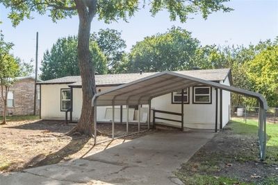 View of front of property featuring a carport | Image 1