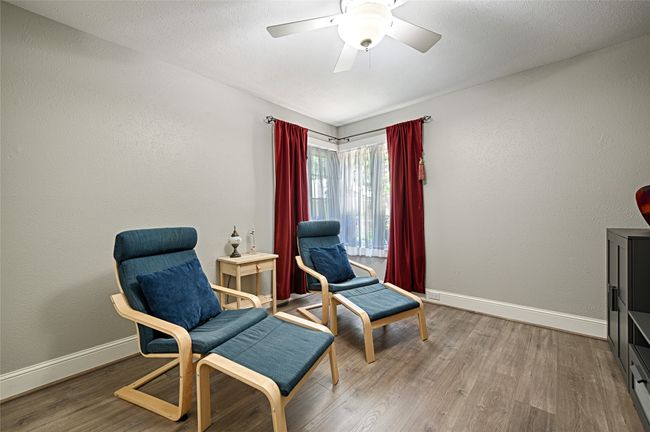 Bedroom used as a 2nd living area. | Image 9