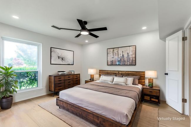 Bedroom featuring light wood-type flooring, recessed lighting, and a ceiling fan | Image 16