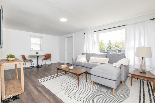 living room featuring baseboards, wood finished floors, and recessed lighting | Image 6