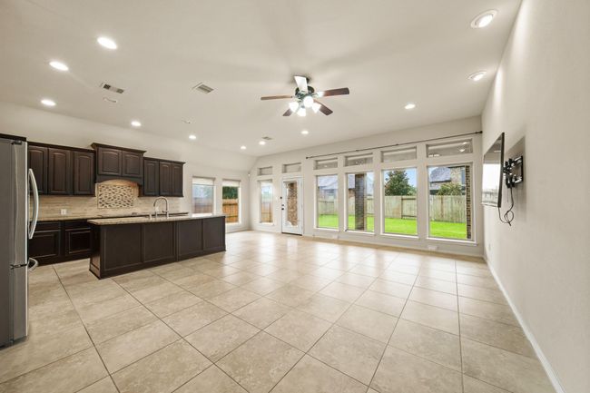 Family room is open to the kitchen. | Image 9