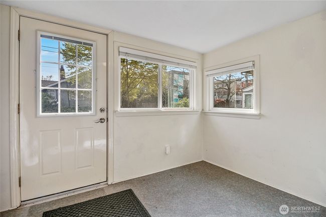 The enclosed back porch is great for storing bikes & outdoor gear. | Image 23