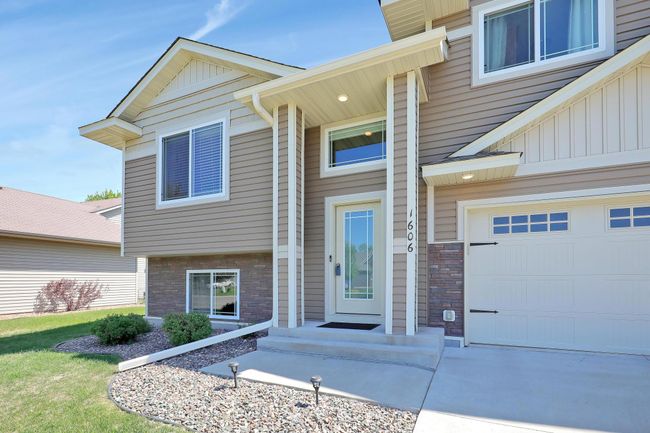 From the moment you arrive, this home impresses with its great curb appeal and beautifully designed front entry. | Image 4