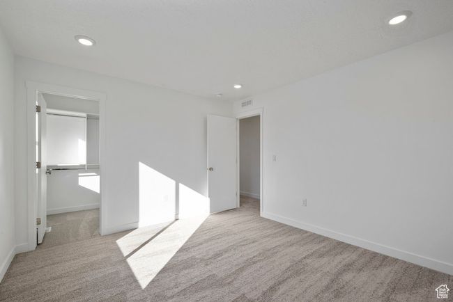 This light-filled bedroom is a blank slate for guests, kids, or a home office setup. | Image 14