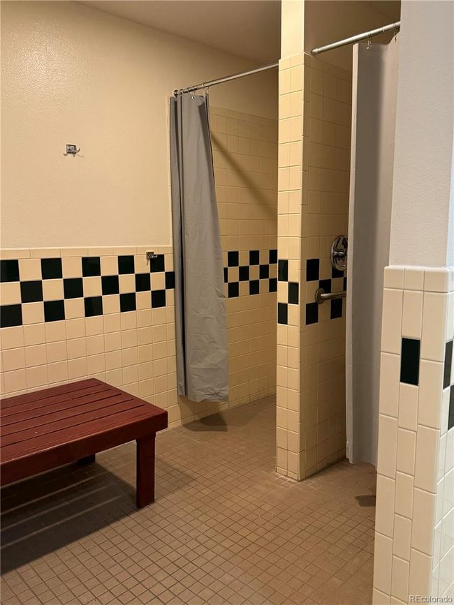 Clubhouse locker room showers. | Image 33