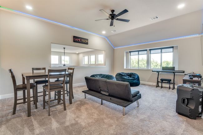 Living room with crown molding, carpet flooring, vaulted ceiling, healthy amount of natural light, and recessed lighting | Image 18