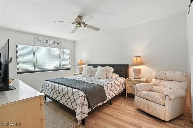 Bedroom featuring light wood-type flooring and ceiling fan | Image 24