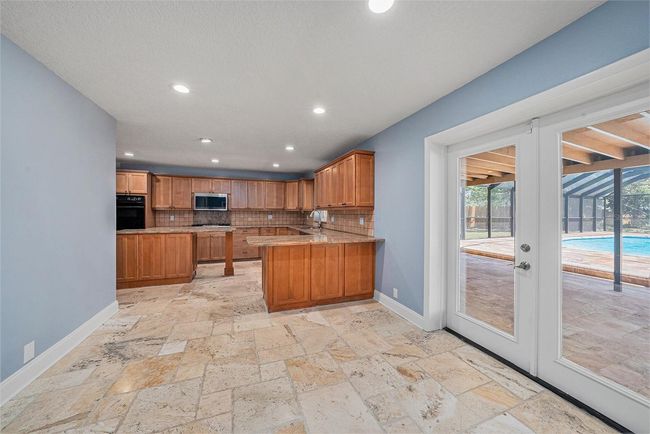 Kitchen and doors too pool | Image 12