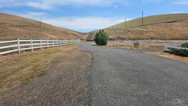 View of street with a mountain view and a view of rural / pastoral area | Image 4