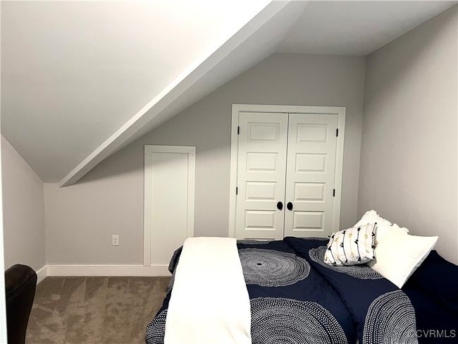 Bedroom 3 featuring carpet floors, vaulted ceiling, and a closet | Image 18