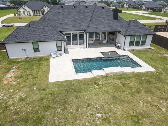 Back of house featuring a yard and a patio area | Image 31