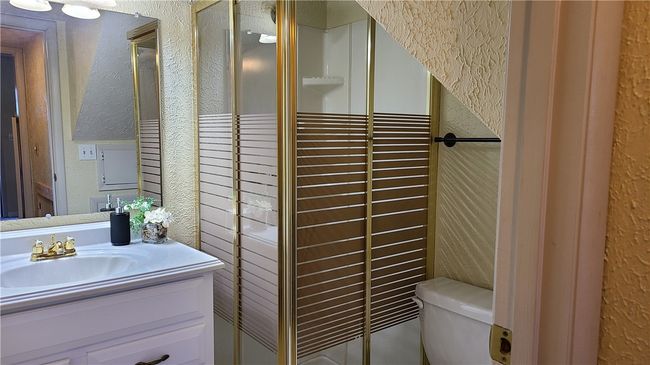 Downstairs bathroom with shower. | Image 10