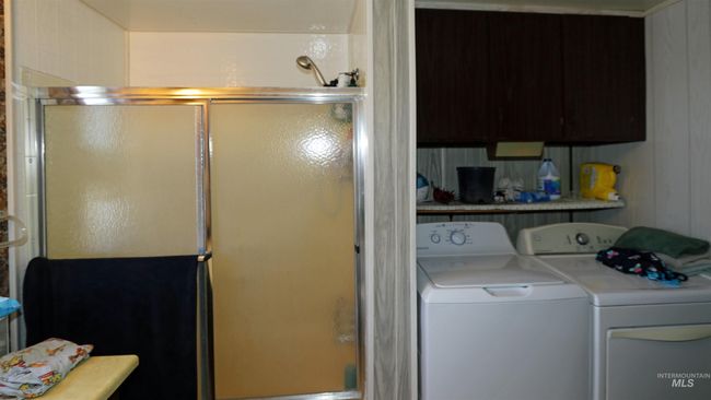 Laundry room featuring washer and clothes dryer | Image 18