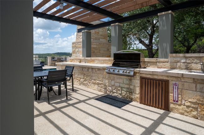 View of patio featuring an outdoor kitchen, outdoor dining space, and a pergola | Image 38