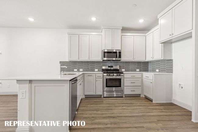 Beautiful finishes paired with a neutral color palette make our Hampton plan kitchen stand out from the crowd! REPRESENTATIVE PHOTO | Image 6