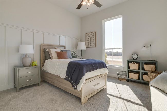 Bedroom with ceiling fan and light colored carpet | Image 24