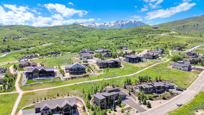 Aerial perspective of suburban area featuring a mountainous background | Image 105